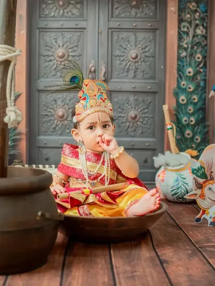This little Krishna is caught in the act, with his hand near the butter pot.