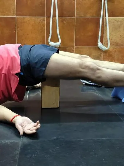 A restorative pose with a chair and block.