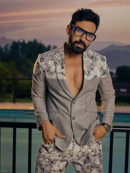 This is where modern style meets fearless design. We crafted this sequined and floral-printed co-ord set for the man who isn't afraid to be the center of attention. It's a perfect example of our fusion wear, blending contemporary silhouettes with dramatic textures for parties and cocktail events.