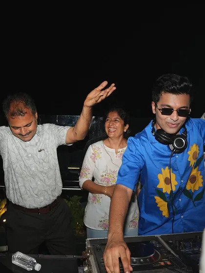 Beyond the big clubs and festivals, I love creating the perfect vibe for private parties. Here I am, spinning tracks and sharing a dance with guests at an intimate gathering.