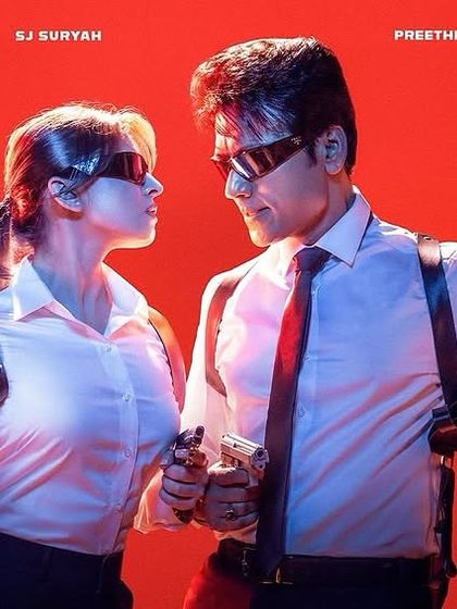 A poster for the Tamil movie *Killer*. I designed these coordinated, action ready outfits for actors SJ Suryah and Preethi Asrani, featuring crisp white shirts and shoulder holsters to fit the film's spy thriller aesthetic.