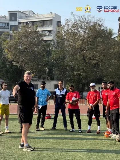 Jason Withe instructing our group of coaches during a practical session on the field. These hands-on clinics are essential for continuous professional development.