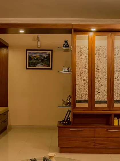 The partition unit shown in its closed state. The fabric panels create a textured, translucent wall that separates the foyer from the living area while still allowing light to pass through.