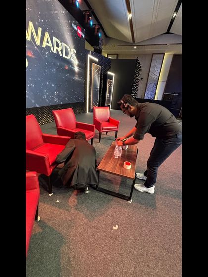 Our stagehands marking positions on the floor for the MakeMyTrip Red Carpet Awards. This ensures that furniture and speakers are placed perfectly for every segment.