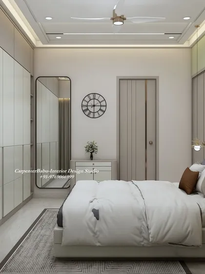 A full-length mirror is strategically placed to make the room feel larger and brighter. The simple clock and minimalist dresser maintain the room's uncluttered aesthetic.