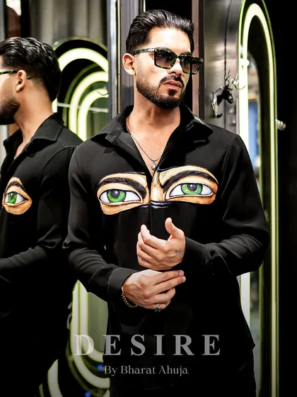 Another view of the 'Haters' eyes shirt, a piece that is as confident and bold as the man who wears it.