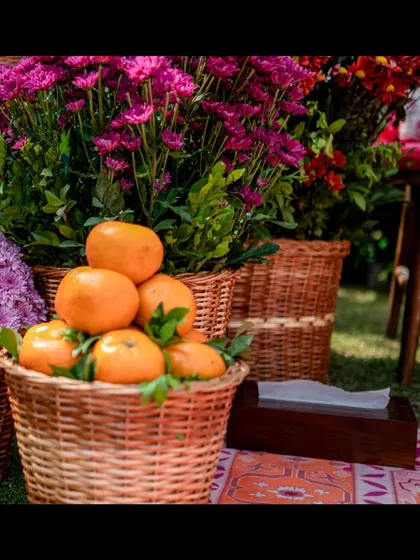 A close-up of a basket of oranges, a simple, fresh, and fragrant decor element that adds a pop of color.