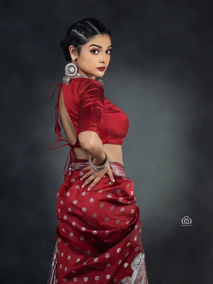 A back view of the modern saree-drape, showing the unconventional styling. This shot highlights the versatility of traditional garments when paired with a contemporary vision.