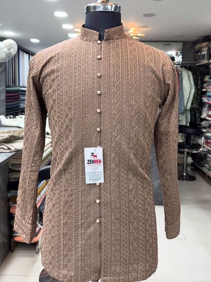 A full view of the inner kurta from the Mocha Brown Jodhpuri set. The all-over texture and elegant buttons make it a beautiful piece on its own.