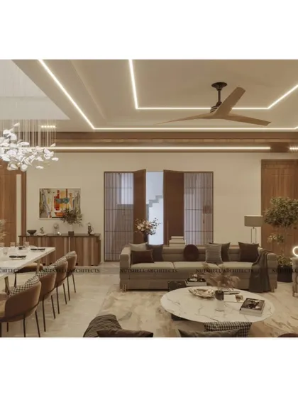 An integrated view of the living and dining areas, showing how we use consistent wood tones and a cohesive lighting scheme to unify the large, open-plan space. The design ensures that each zone feels distinct yet connected.