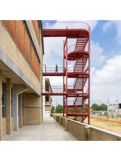 A sculptural red staircase provides external circulation for the RSL Office. This element is designed to be a functional piece of art and will be integrated into the next phase of the building's construction.