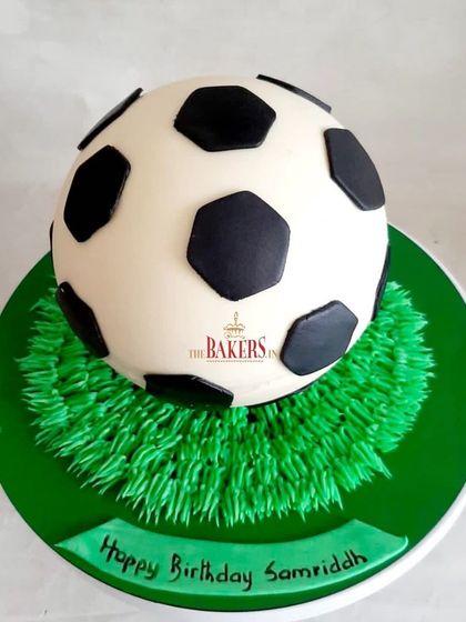 A fun football pinata cake! This spherical cake is filled with surprises. You can smash it open to reveal a cascade of chocolates and candies inside.