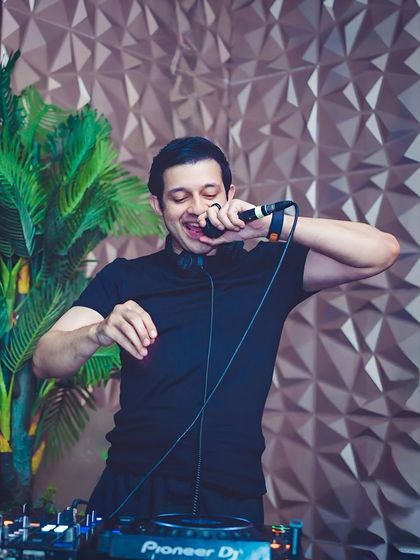 Getting the crowd hyped on the microphone. An interactive host is key to a great party, and I make sure to engage with everyone.