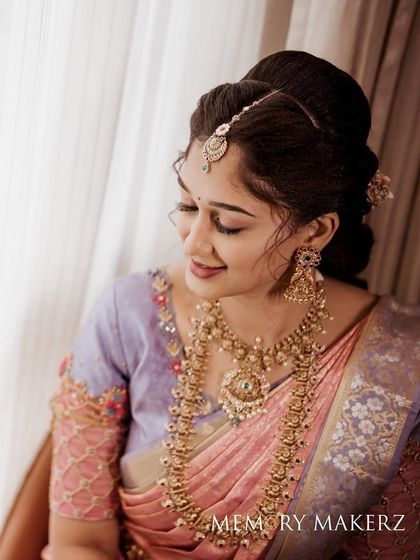 A side profile of Surabhi's engagement look, showing the intricate hairstyle and the beautiful jewellery.
