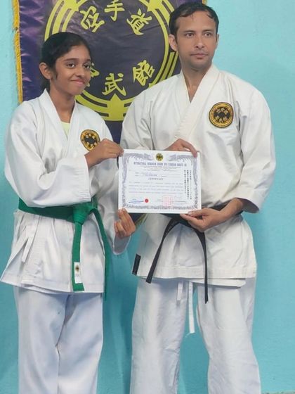 This student has successfully passed her grading for the 4th Kyu (green belt). Her hard work and spirit are an inspiration.