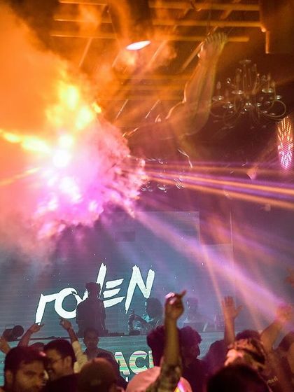 An explosion of pyrotechnics and smoke at Mikachi Club, Pune. These effects are timed perfectly with the music to create a high-impact, sensory experience for the audience.