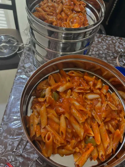 Beyond traditional Indian food, I also cater dishes like this red sauce penne pasta, prepared in large batches for party buffets. The sauce is always made from scratch with fresh tomatoes and herbs.