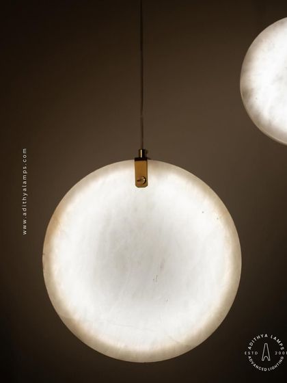 Showcasing our disc-shaped marble pendants. The light emanates softly through the thin slice of natural marble, revealing its unique veining. These fixtures are available in different shapes and look stunning hung in pairs or trios.