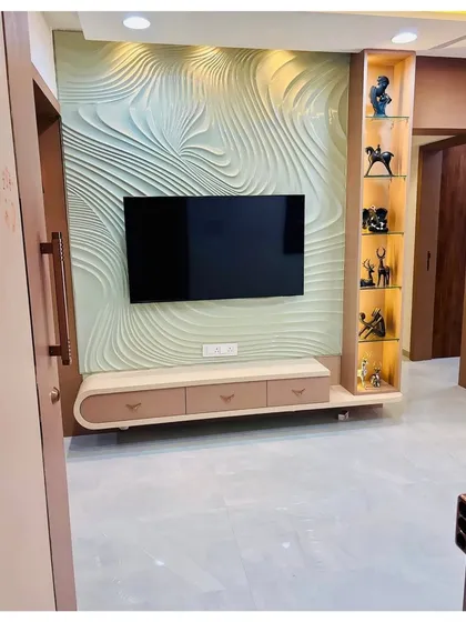 A wider angle of the 3D textured TV unit, showing how it commands attention in the room. The design is both a functional media center and a piece of sculptural art.