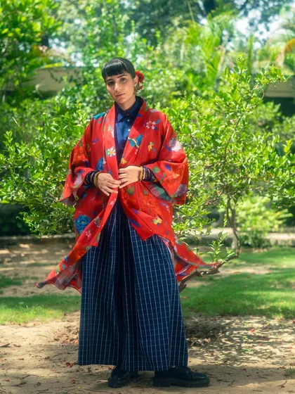 An example of my personal style, layering a vintage-style red kimono over a modern collared shirt and wide-leg pants.