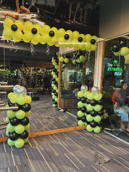 This image shows the interior view of the gym decoration. I placed balloon pillars and simple garlands inside to carry the theme throughout the space, ensuring the festive look is visible from all angles.