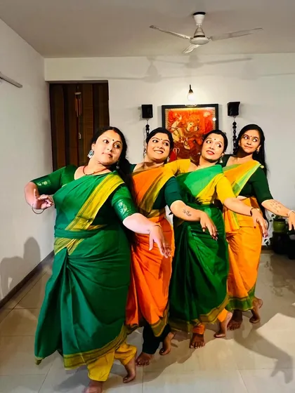 Our dancers in vibrant green and orange sarees, ready for our performance for Natyaniketan's 47th anniversary.
