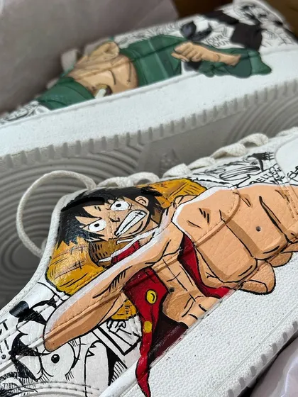 A close up of the Luffy side of the One Piece custom Nikes. The energy in his pose is just jumping off the shoe.