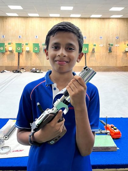 Muneeb, a silver medalist in the Under-14 category, holding his air pistol at the ICSE competition.