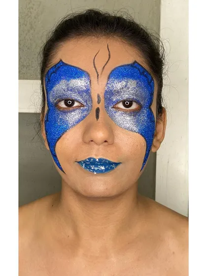 This is where I love to play. I created this bold, high-fashion butterfly look with vibrant blue and silver glitter, perfect for an editorial shoot or a model's portfolio that needs to stand out.