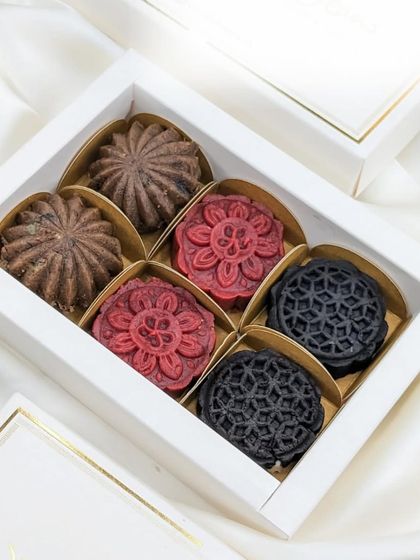 The elegant white and gold gift box for our Xmas Cake Mithai, making it a perfect and sophisticated holiday gift.