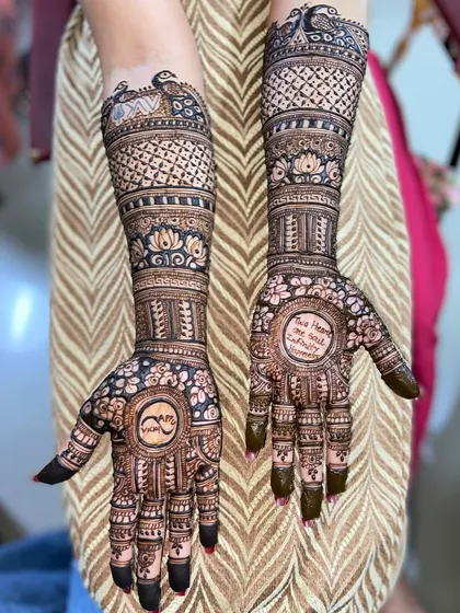 A clear photo of the personalized mehandi with the name logo and quote, showing the fine details of the lettering.
