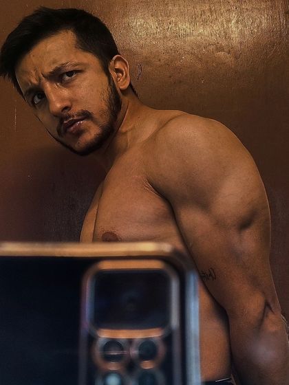 A close-up showing the bicep and shoulder tie-in. Details like this come from years of focused training.