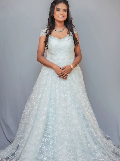 A white Christian wedding gown available for rent. A simple yet elegant choice for your special day.