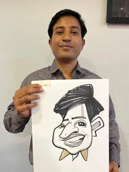 A guest from the Nashik wedding trip with his caricature. I travel all over for events, bringing my art to celebrations everywhere.