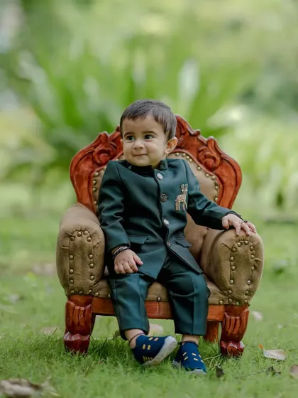A classic, seated portrait of baby Ishan in his formal green suit. He looks so charming and content, resulting in a timeless image that his parents will adore.