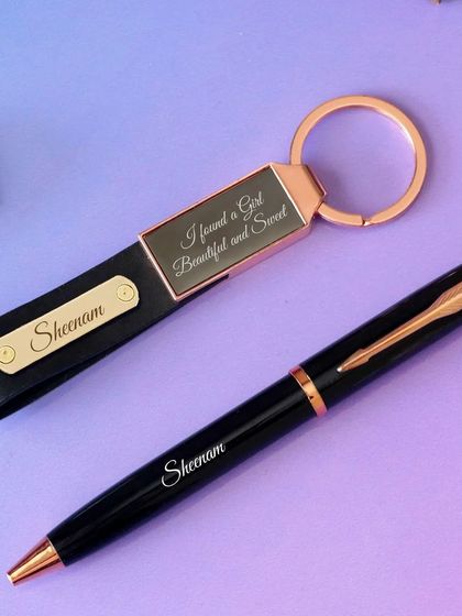 This is my premium pen and keychain set, a perfect mini-combo gift. The set includes a black and rose-gold metal pen and a matching leather strap keychain, both of which can be engraved with a name or a short message.