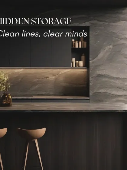 Hidden storage is key to a minimalist kitchen, creating clean lines for a clear mind. This design uses handleless cabinets and a dark, natural stone finish to create a dramatic and uncluttered look.