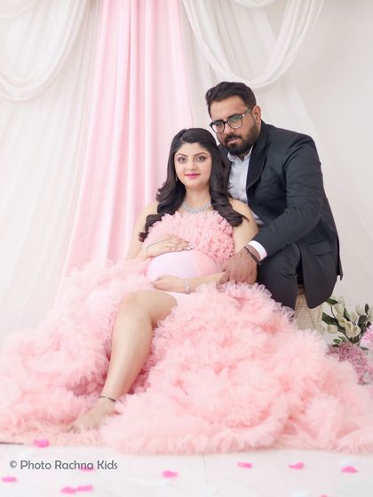 A classic seated portrait of the expecting couple. This pose is comfortable for the mom-to-be and results in a beautiful, timeless photograph.