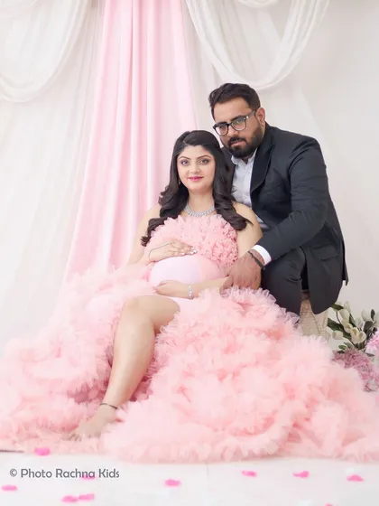 A classic seated portrait of the expecting couple. This pose is comfortable for the mom-to-be and results in a beautiful, timeless photograph.