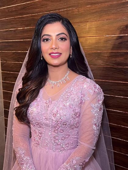 Her smile shows how confident and beautiful she feels in this classic, princess-inspired hairstyle.