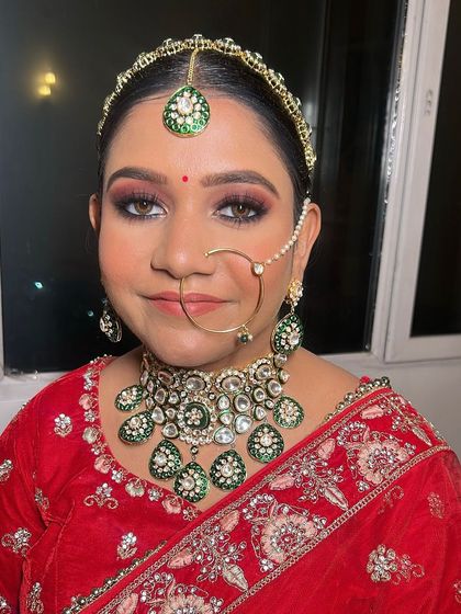 A close-up portrait of the bride. Her flawless base, defined eyes, and perfectly shaped brows complete this stunning bridal makeover.