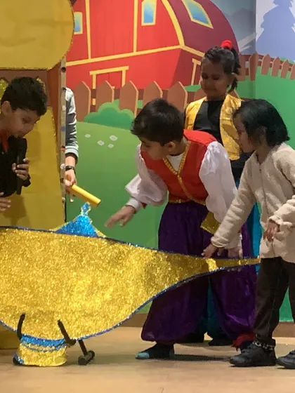 The magical moment of discovering the lamp. Our workshops bring classic stories to life, allowing kids to act out their favorite scenes with creative props and sets.