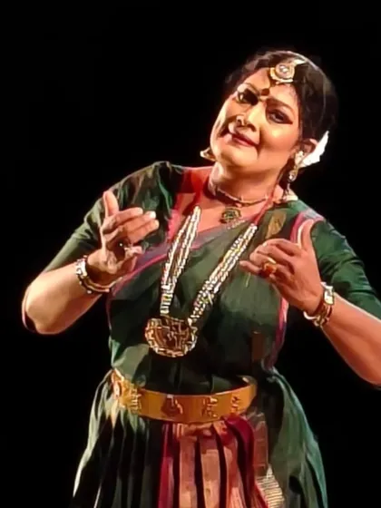 A moment of expressive storytelling from my performance at Uttam Manch, Kolkata. The green and red costume, a classic combination, stands out against the dark stage, focusing all attention on the dance.