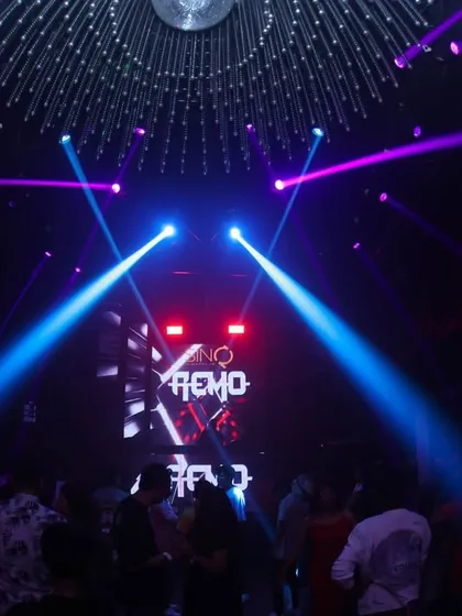 Laser beams cutting through the darkness at SinQ Nightclub in Goa. The light show is an essential part of the superclub experience I provide.