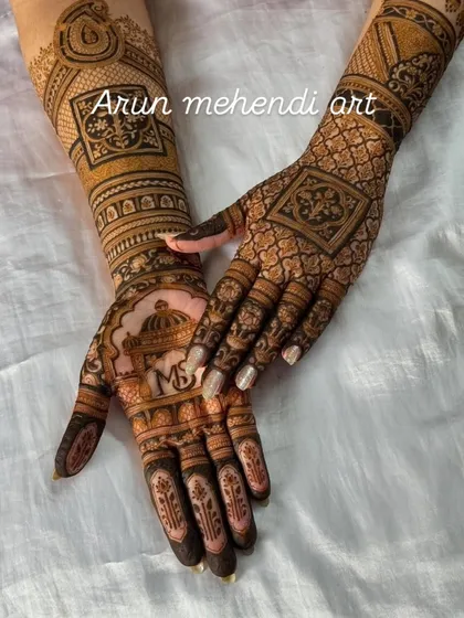 A beautiful example of pattern work, this design features a mix of jaal, floral borders, and a personalized initial monogram.