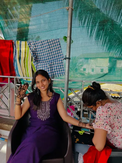 A candid shot from a mehendi appointment, showing the relaxed and happy atmosphere I create for my clients.