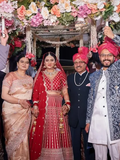 The bride making her entrance with her family, a proud and emotional moment for everyone.