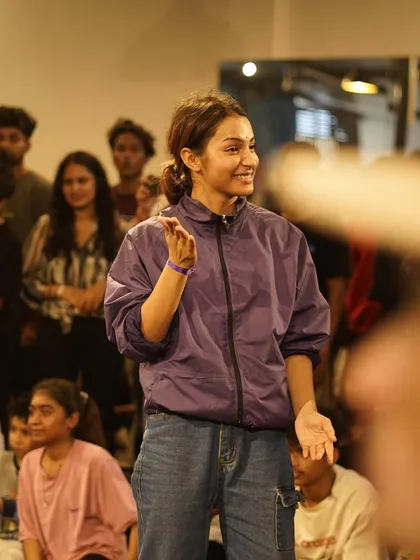 A candid moment of a b-girl enjoying the atmosphere at one of our jams. Beyond the battles, our events are about community, connection, and having a good time.