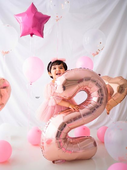 So much joy in one photo! This little one is having the best time with a giant '2' balloon for her birthday.