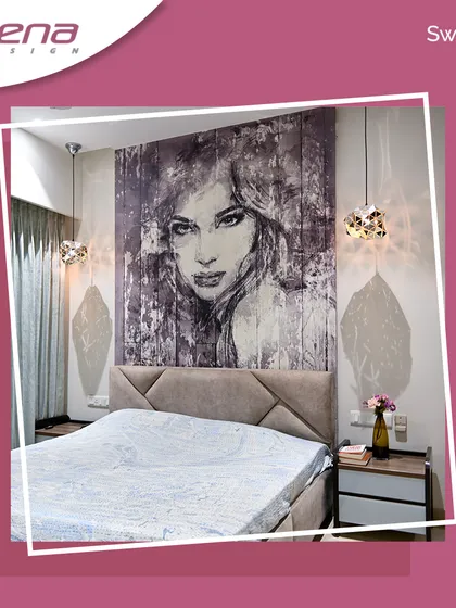 A premium bedroom design featuring a large, artistic portrait as the centerpiece. The geometric patterned headboard and unique hanging lights on either side of the bed add to the room's sophisticated and modern charm.